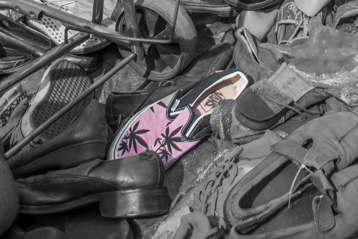 Horizontal monochrome field in dark gray tones, with strong contrast, defined edges, and a layered field